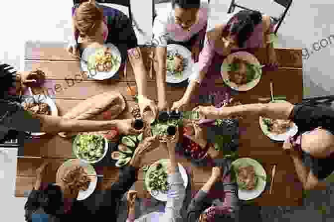 A Group Of People From Different Cultures Sharing A Meal, Symbolizing The Breaking Of Barriers And The Forging Of Connections Female Nomad And Friends: Tales Of Breaking Free And Breaking Bread Around The World