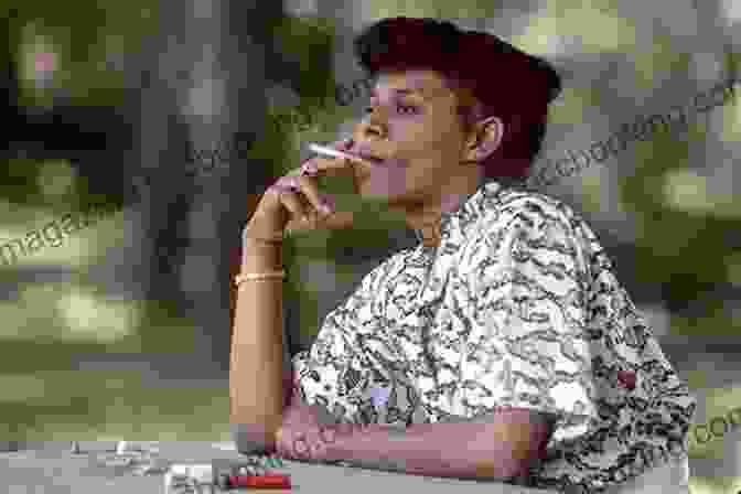 An African American Woman Smoking A Cigarette Pushing Cool: Big Tobacco Racial Marketing And The Untold Story Of The Menthol Cigarette