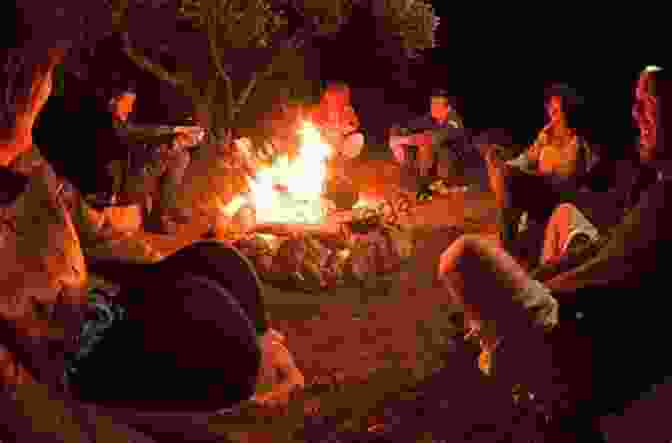 Diverse Group Of Individuals Gathered Around A Campfire, Symbolizing The Power Of Community Own The Arena: Getting Ahead Making A Difference And Succeeding As The Only One