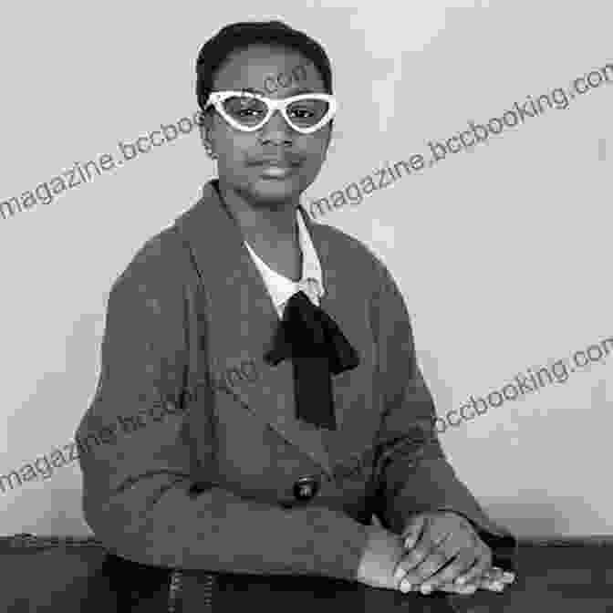 Septima Clark, A Smiling Woman With Short Hair And Glasses, Sits At A Desk With A Group Of Students. Freedom S Teacher: The Life Of Septima Clark